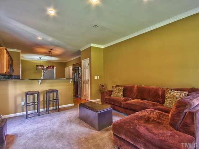 8008 Mill Bluff Court Raleigh, NC 27616 - Photo 13 of 25 a living room with furniture and a couch