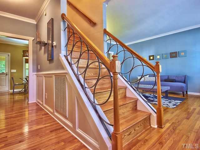 8008 Mill Bluff Court Raleigh, NC 27616 - Photo 3 of 25 a view of entryway and hall with wooden floor