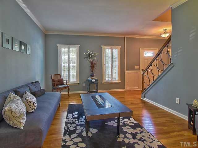 8008 Mill Bluff Court Raleigh, NC 27616 - Photo 4 of 25 a living room with furniture and a rug