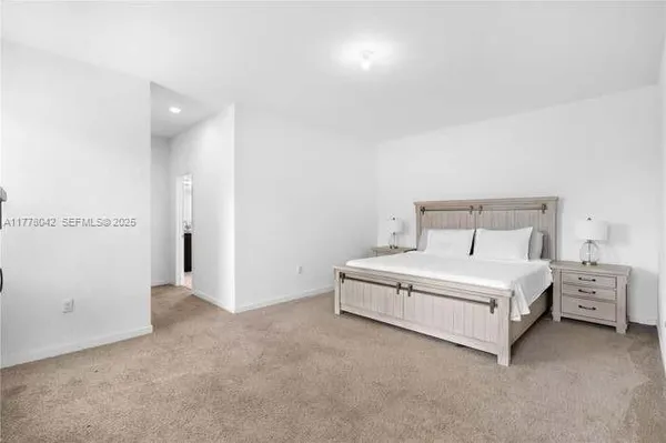 a room with a bed and a night stand