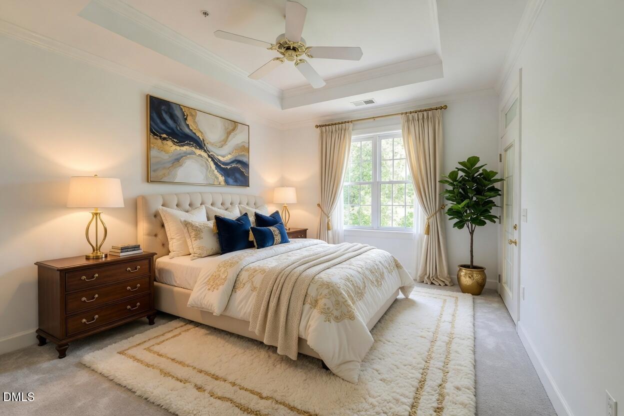 116 Northbrook Drive, Unit 305 Raleigh, NC 27609 - Photo 5 of 43 a bedroom with a bed and a potted plant