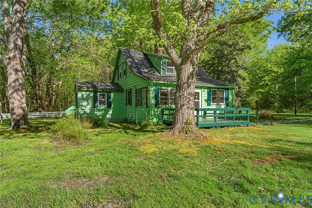2097 Coles Point Road Hague, VA 22469 - Photo 4 of 34 a house is sitting in middle od the grass