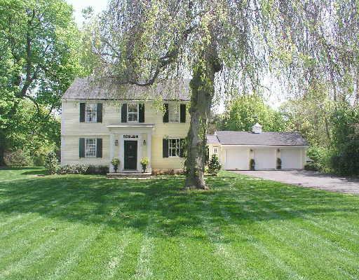 515 Old Post Road Fairfield, CT 06824 - Photo 1 of 1 a view of a house with a big yard and large trees