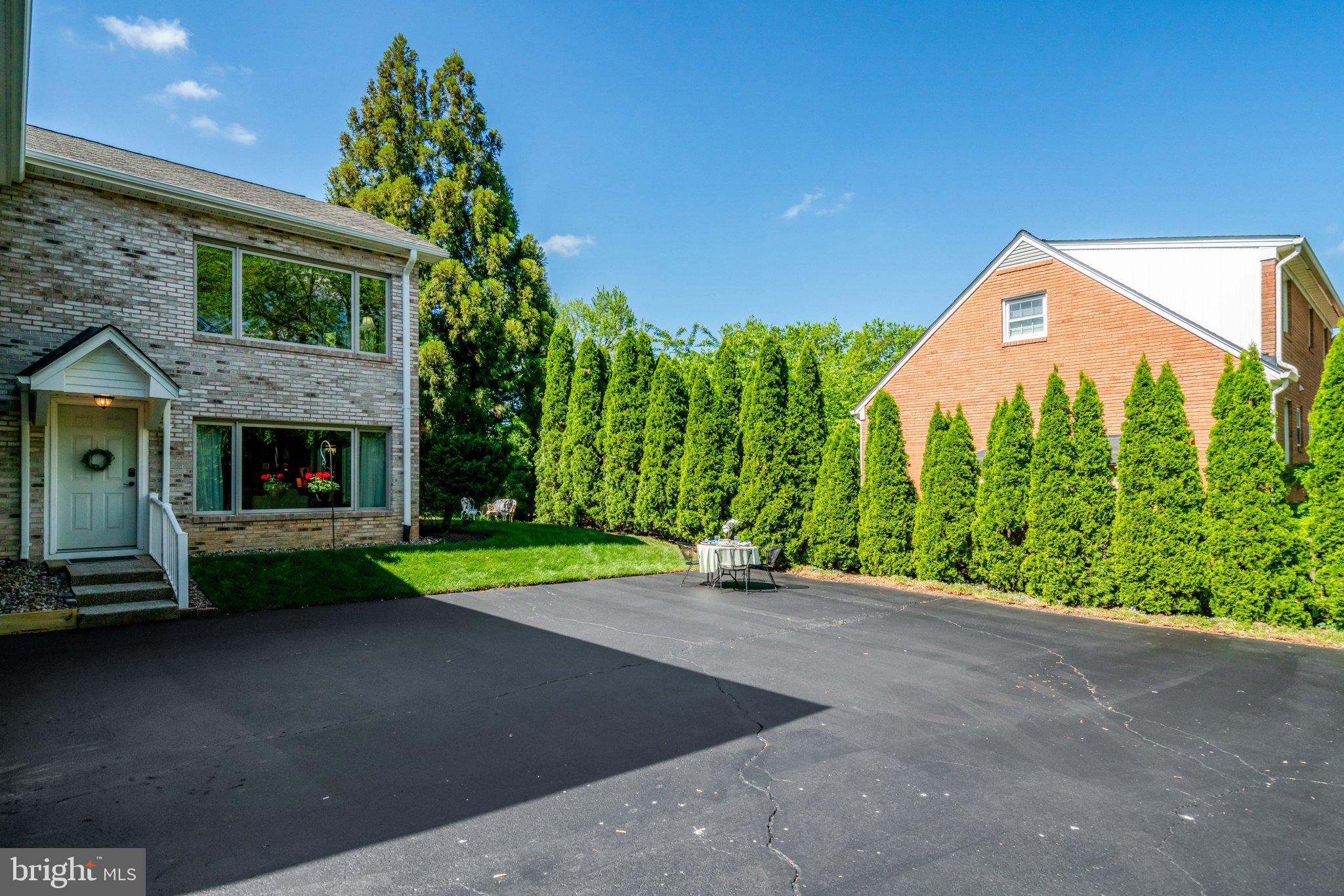 1812 A Birch Road McLean, VA 22101 - Photo 54 of 59 Spacious driveway with lush greenery.