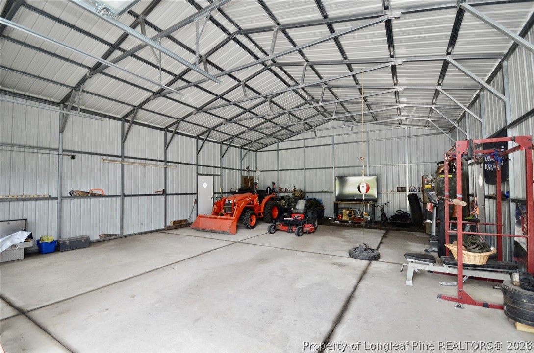 1865 John B Carter Road Fayetteville, NC 28312 - Photo 39 of 49 a view of a garage with rack and bicycle