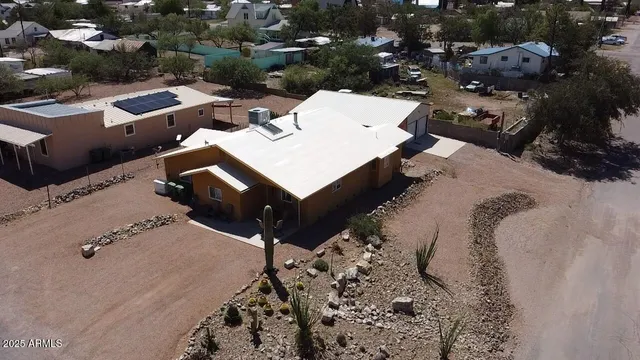 an aerial view of a house with a yard