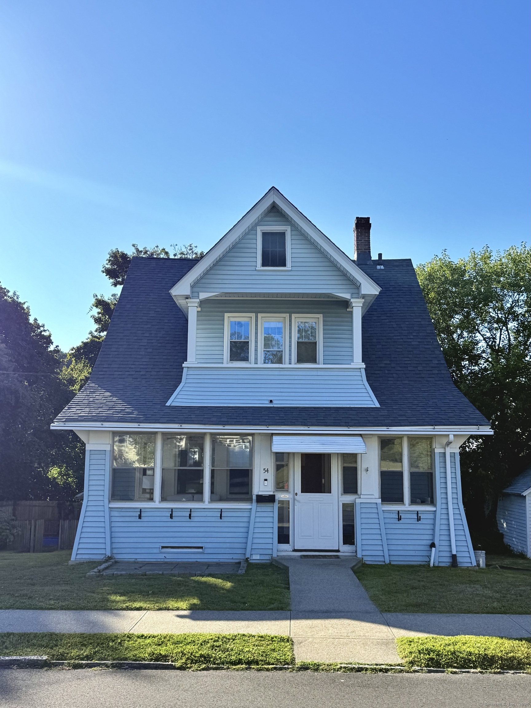 front view of a house with a yard