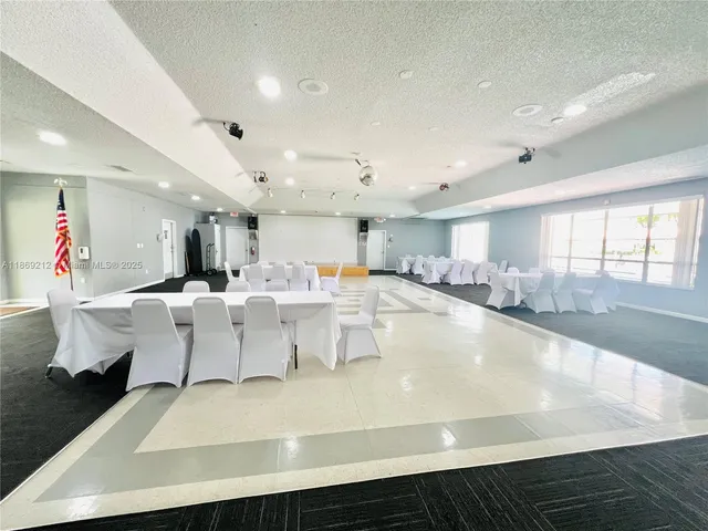 a large white kitchen with lots of counter top space