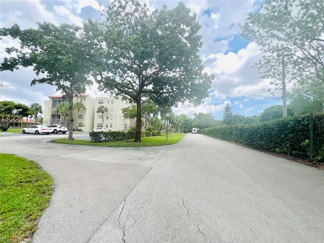 a view of road with card parked