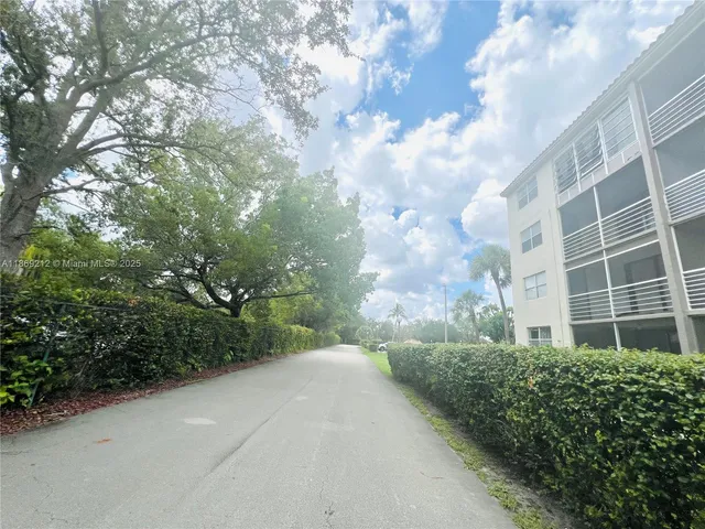 a view of a building with a yard