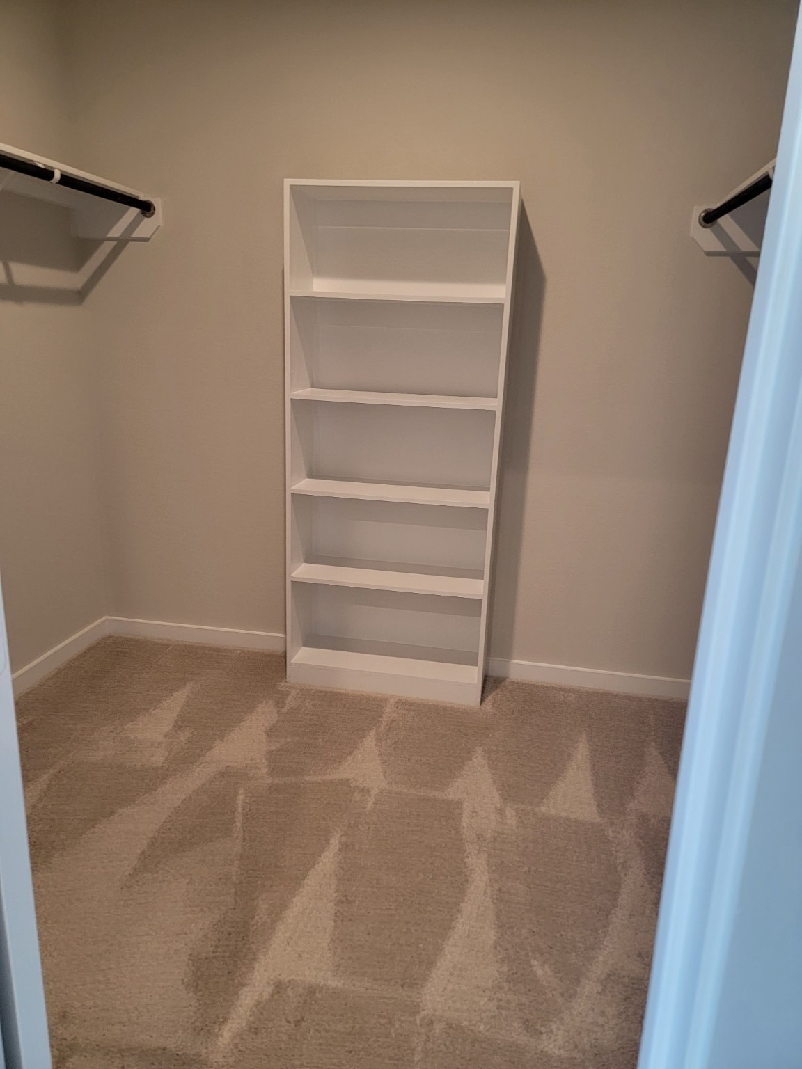 3130 Boulder Ridge Drive Rosenberg, TX 77471 - Photo 26 of 32 a view of walk in closet with empty racks