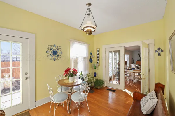 a kitchen with stainless steel appliances white cabinets and a refrigerator