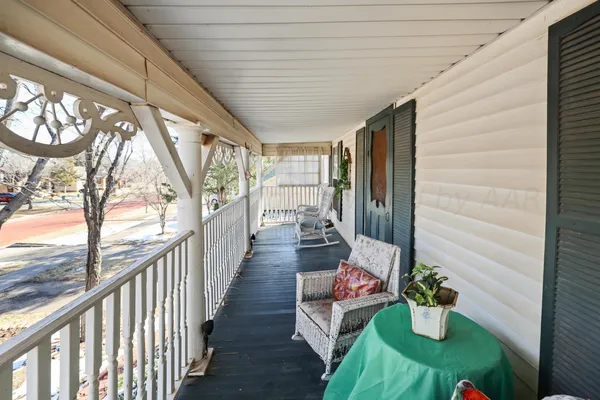 a kitchen with granite countertop a refrigerator and a sink