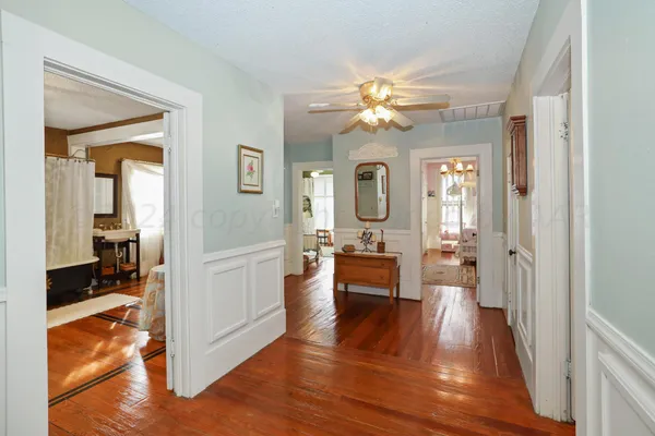 a view of a brick house with wooden fence
