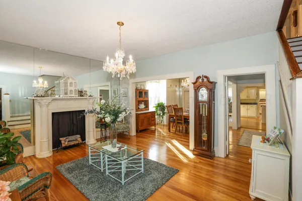 a kitchen with sink a table and chairs