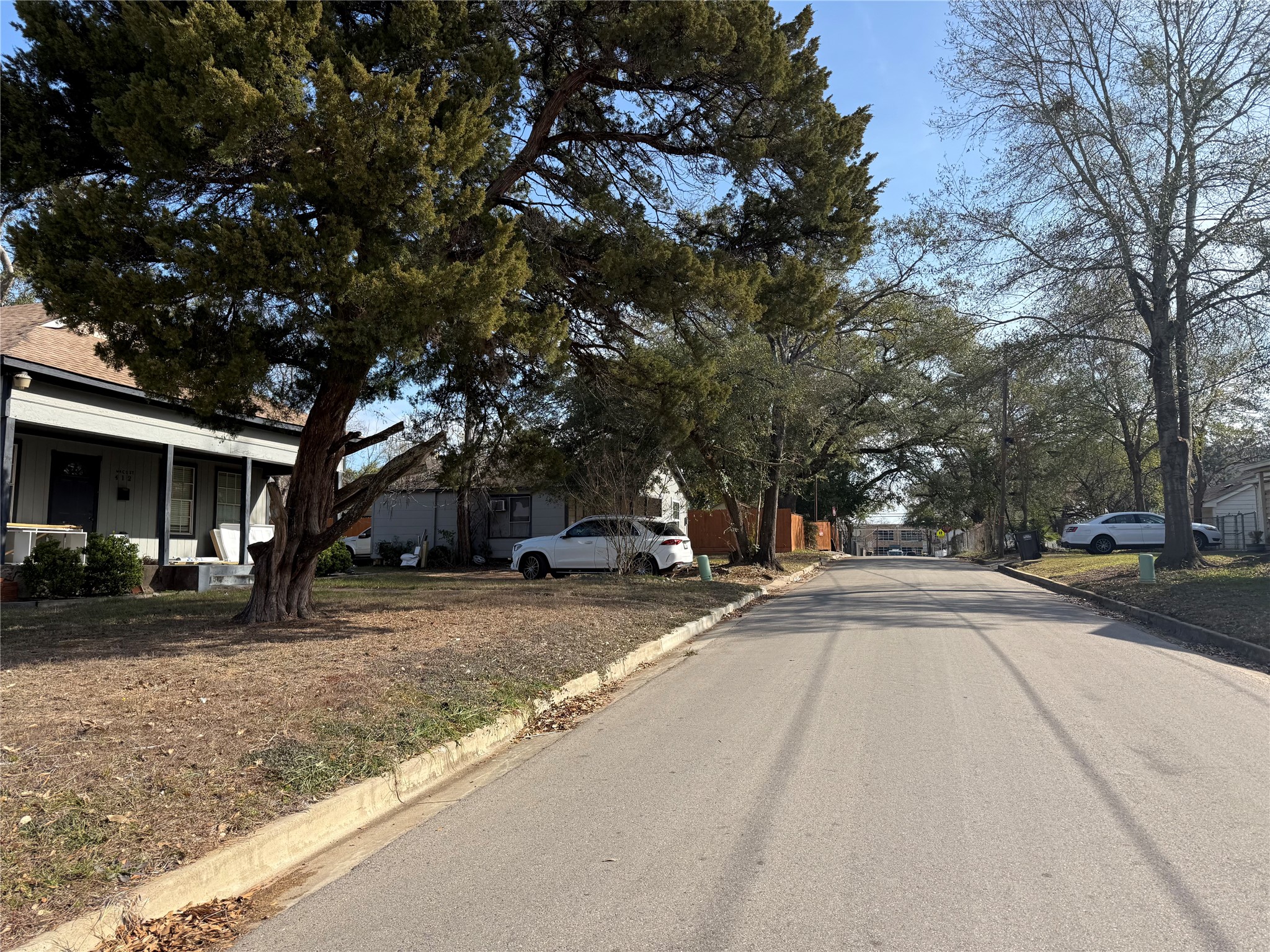 412 Waco Street Conroe, TX 77301 - Photo 14 of 50 a view of road with trees