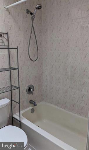 1201 South 13th Street, Unit A Philadelphia, PA 19147 - Photo 8 of 13 a bathroom with a granite countertop toilet and a bath tub