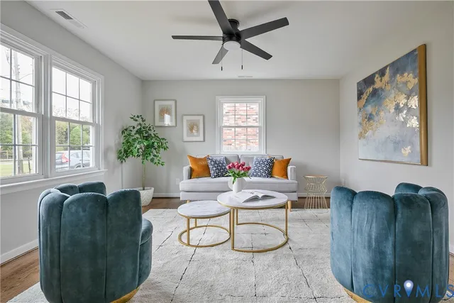a living room with furniture and a large window