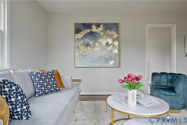 a room with furniture and a potted plant