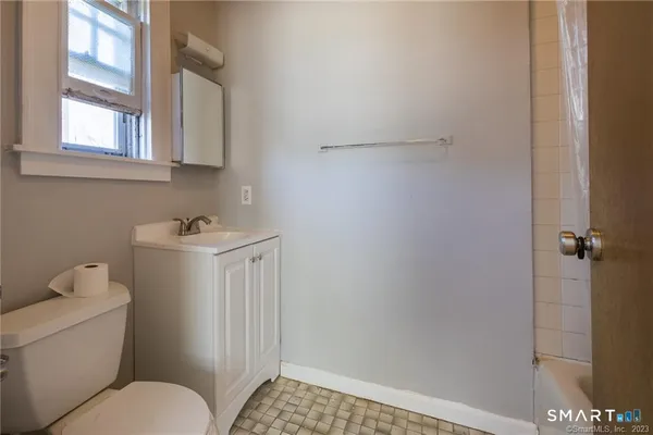 a bathroom with a toilet and a sink
