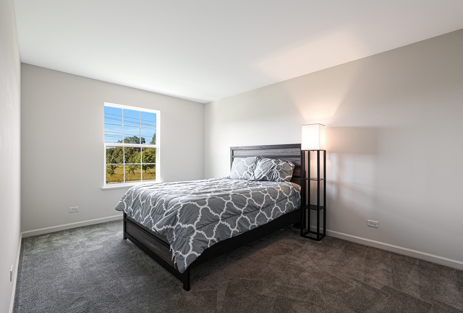 5835 Fairview Lane Hoffman Estates, IL 60192 - Photo 17 of 33 a bed sitting in a bedroom next to a window