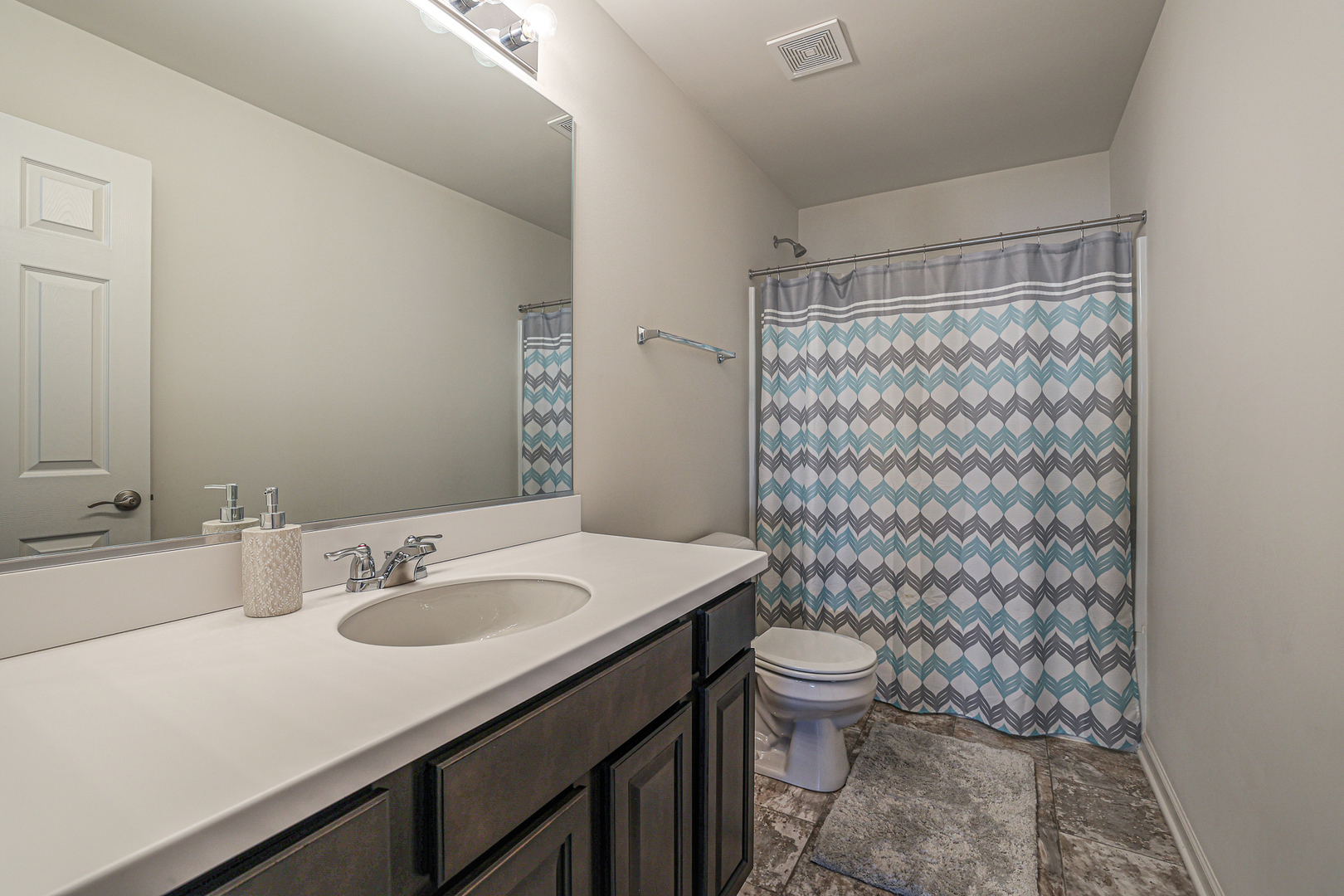 5835 Fairview Lane Hoffman Estates, IL 60192 - Photo 18 of 33 a bathroom with a sink toilet and shower
