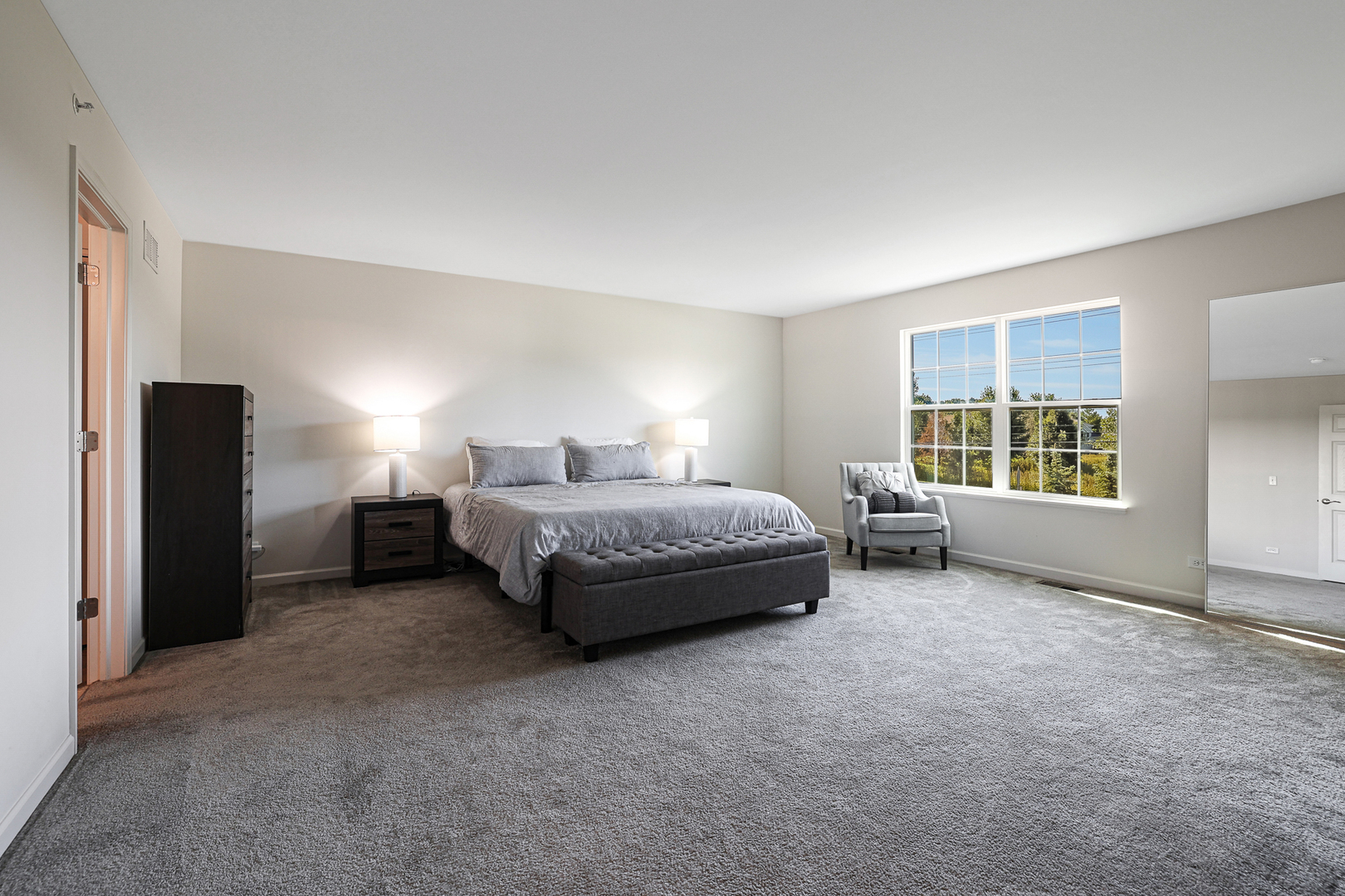 5835 Fairview Lane Hoffman Estates, IL 60192 - Photo 20 of 33 a spacious bedroom with a bed and a window