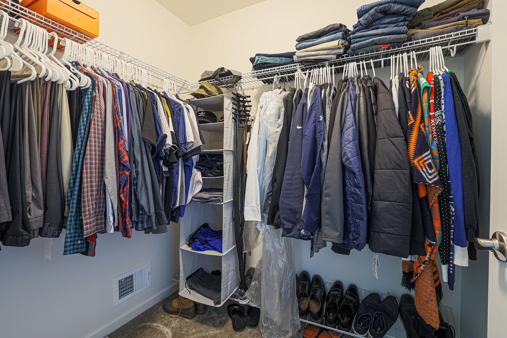 5835 Fairview Lane Hoffman Estates, IL 60192 - Photo 26 of 33 a view of walk in closet with clothes and shoes
