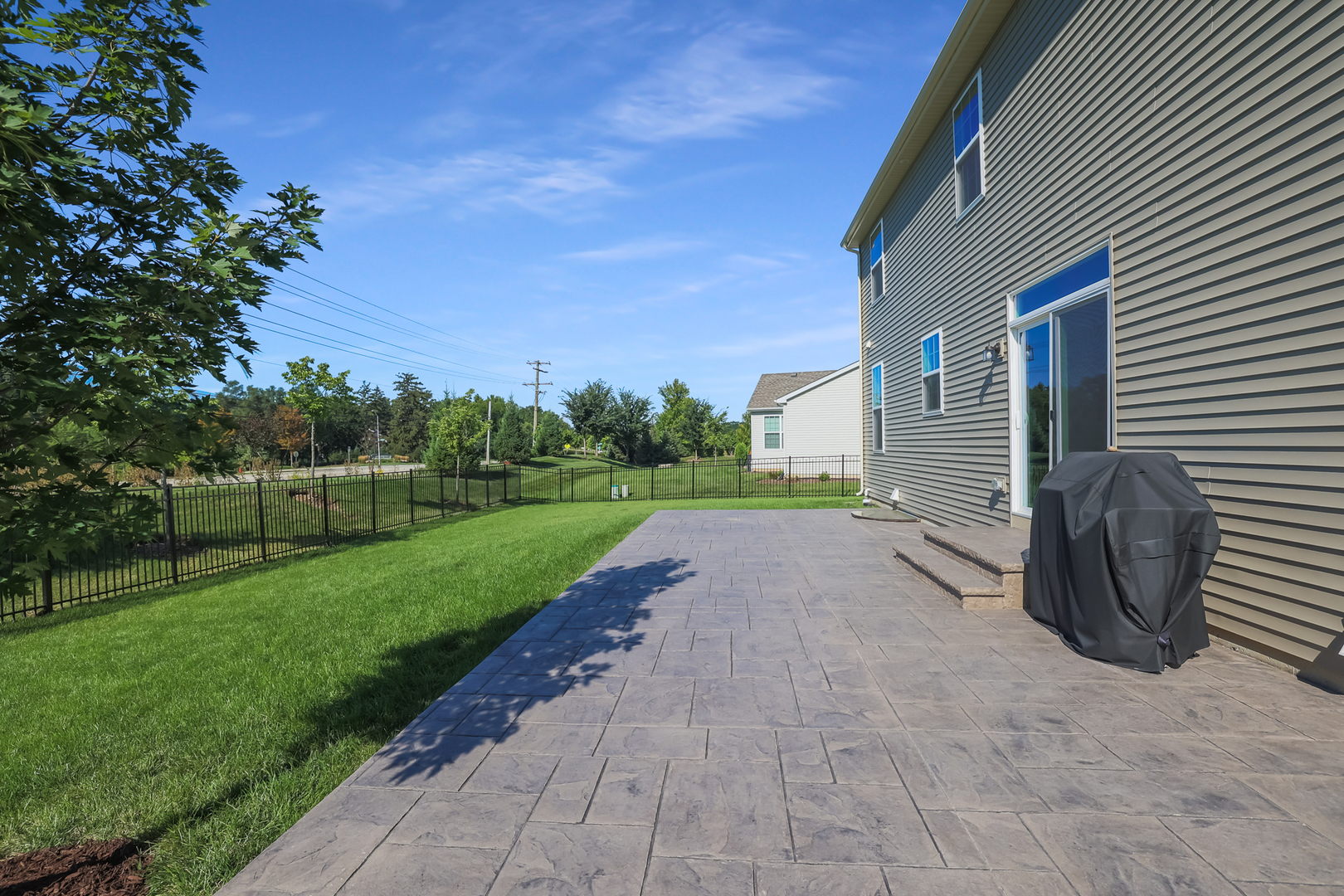 5835 Fairview Lane Hoffman Estates, IL 60192 - Photo 31 of 33 a view of a backyard with porch and entertaining space