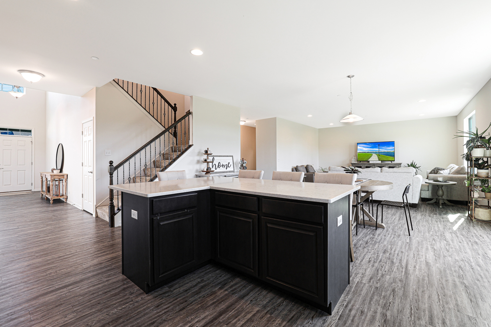 5835 Fairview Lane Hoffman Estates, IL 60192 - Photo 6 of 33 a kitchen with a sink dishwasher and a dining table with wooden floor