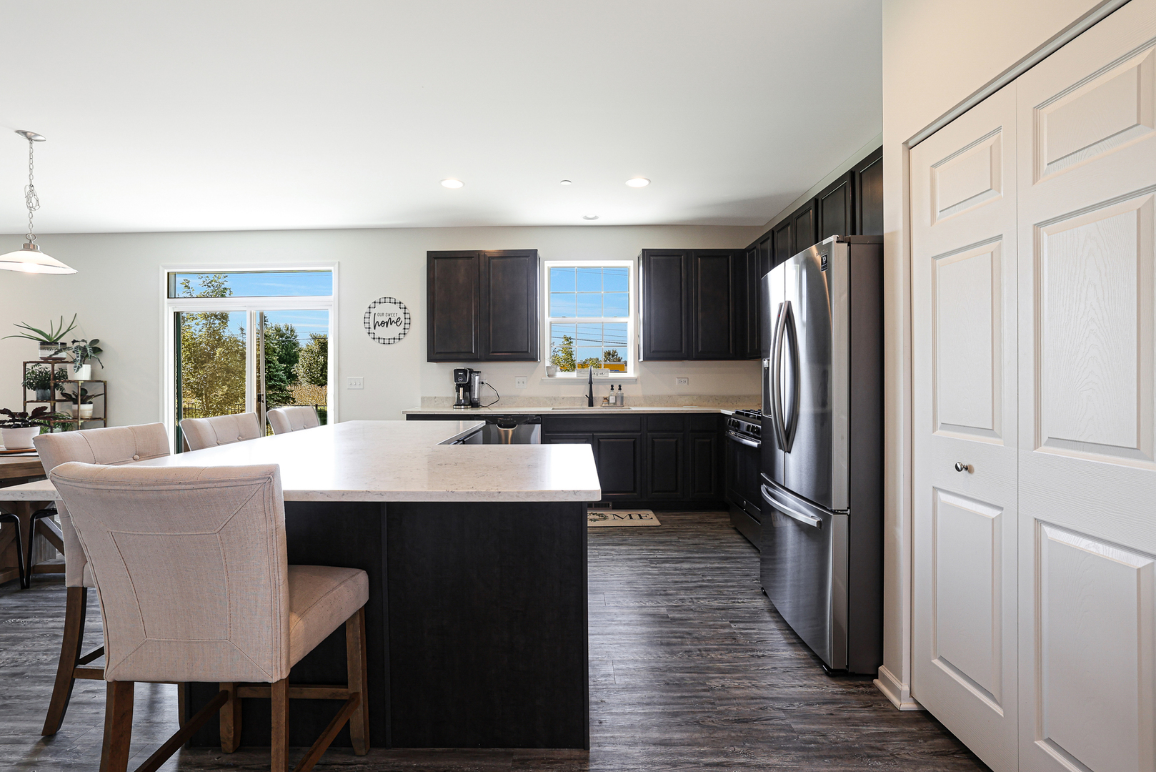 5835 Fairview Lane Hoffman Estates, IL 60192 - Photo 7 of 33 a kitchen with stainless steel appliances a sink stove and refrigerator