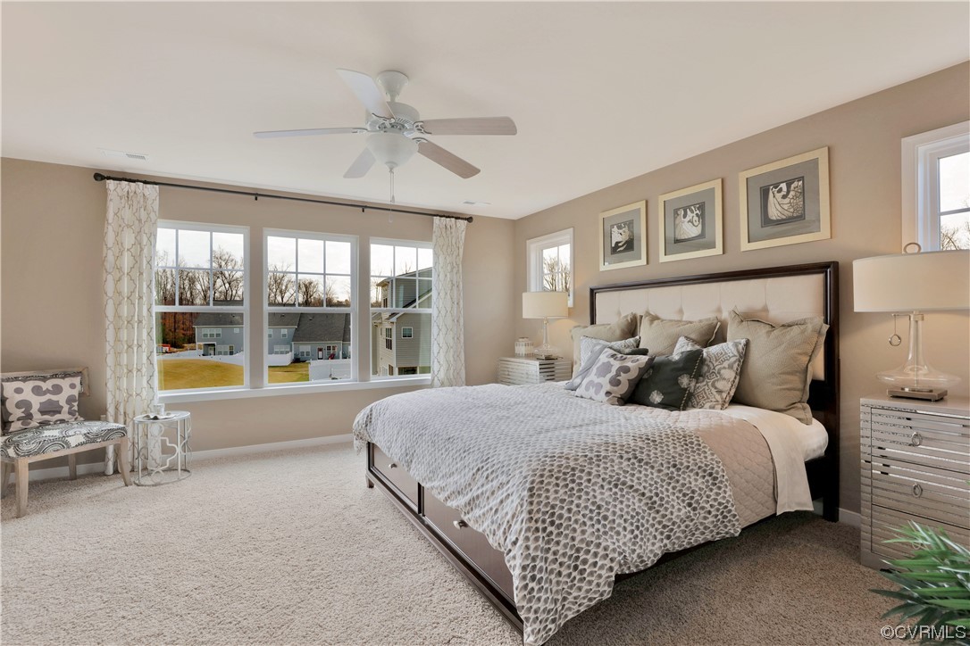 12918 Deep Wl Road Midlothian, VA 23112 - Photo 19 of 50 a bedroom with a large bed and a large window