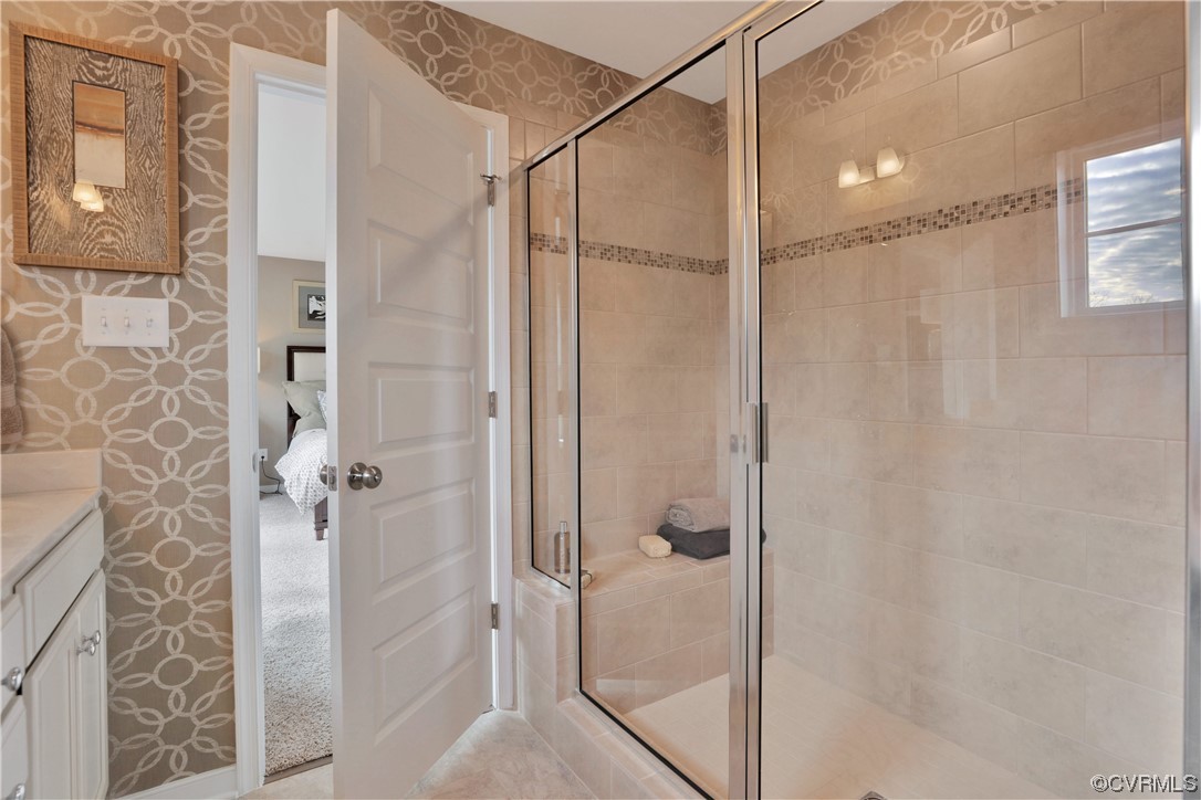 12918 Deep Wl Road Midlothian, VA 23112 - Photo 23 of 50 a bathroom with a glass shower door