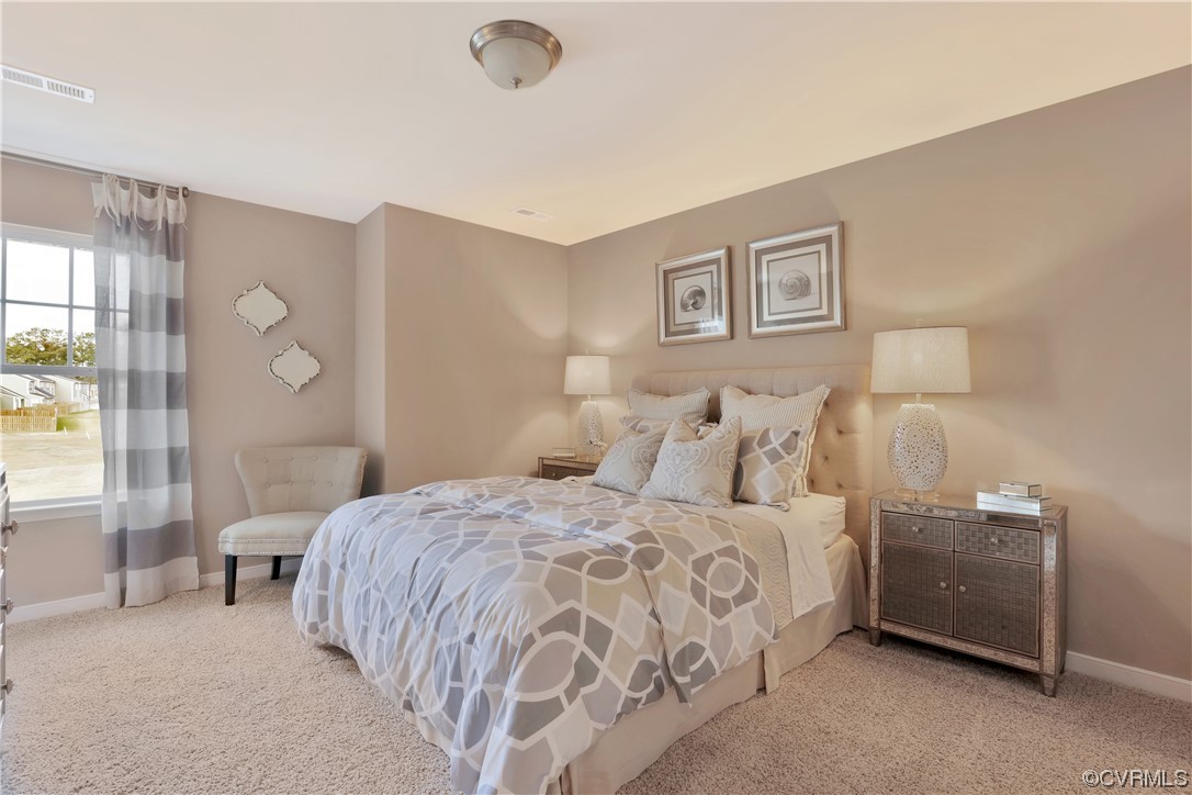 12918 Deep Wl Road Midlothian, VA 23112 - Photo 26 of 50 a bedroom with a bed and a night stand