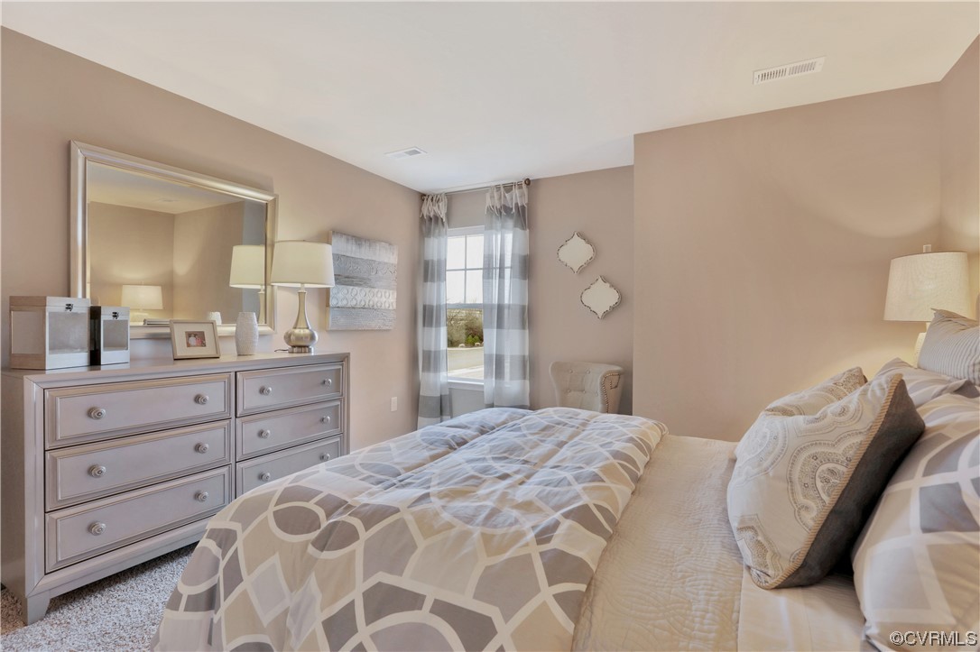 12918 Deep Wl Road Midlothian, VA 23112 - Photo 27 of 50 a bedroom with a large bed and a dresser