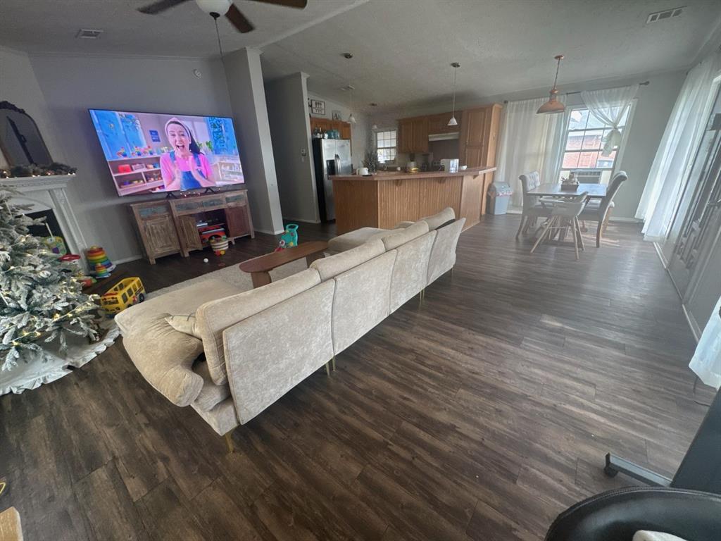 3814 Middlefield Street, Unit DA Dallas, TX 75253 - Photo 4 of 7 a living room with furniture and a flat screen tv