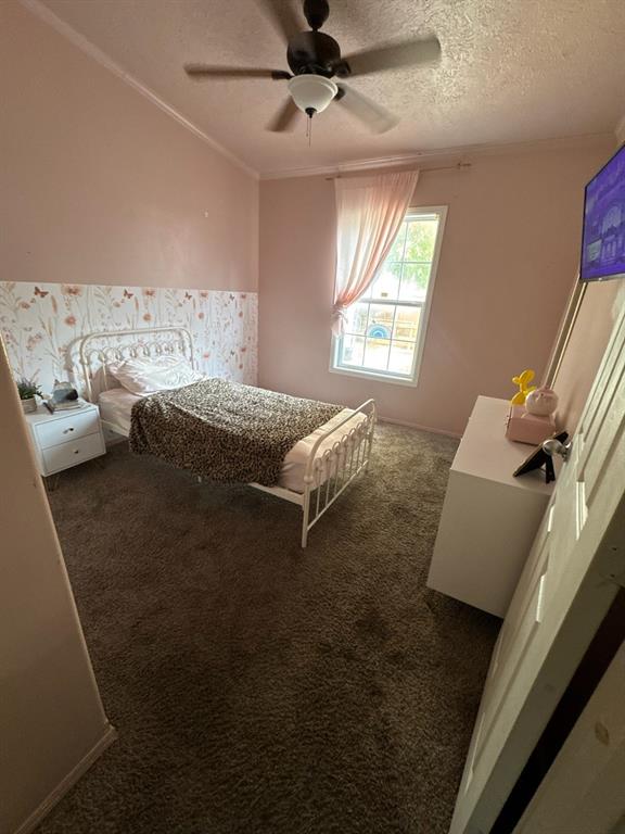 3814 Middlefield Street, Unit DA Dallas, TX 75253 - Photo 6 of 7 a bedroom with a bed and window