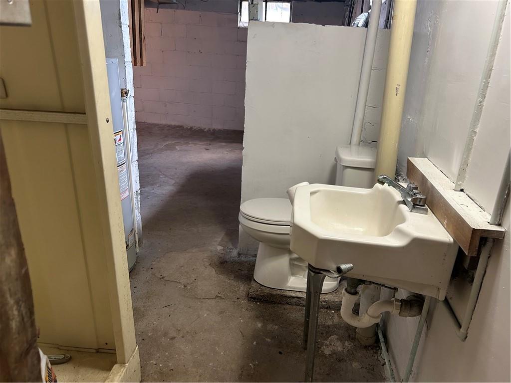 314 Terrace McKeesport, PA 15135 - Photo 16 of 19 a bathroom with a sink a toilet and a mirror