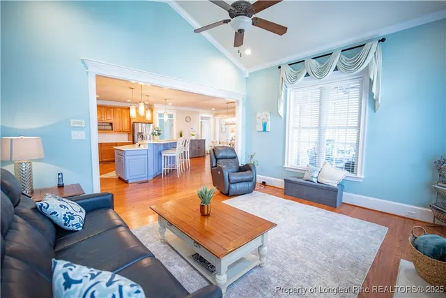 a living room with furniture rug and window