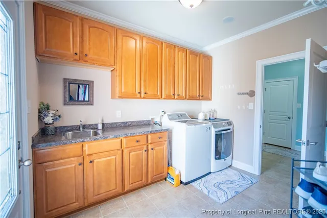 a room with a sink cabinets and a window