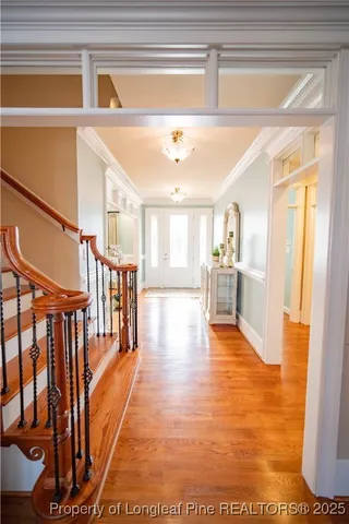 a view of an entryway with wooden floor