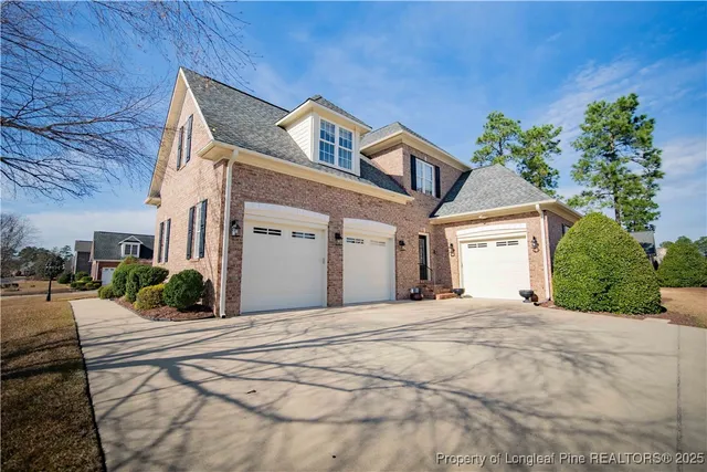 a view of a house with a small yard