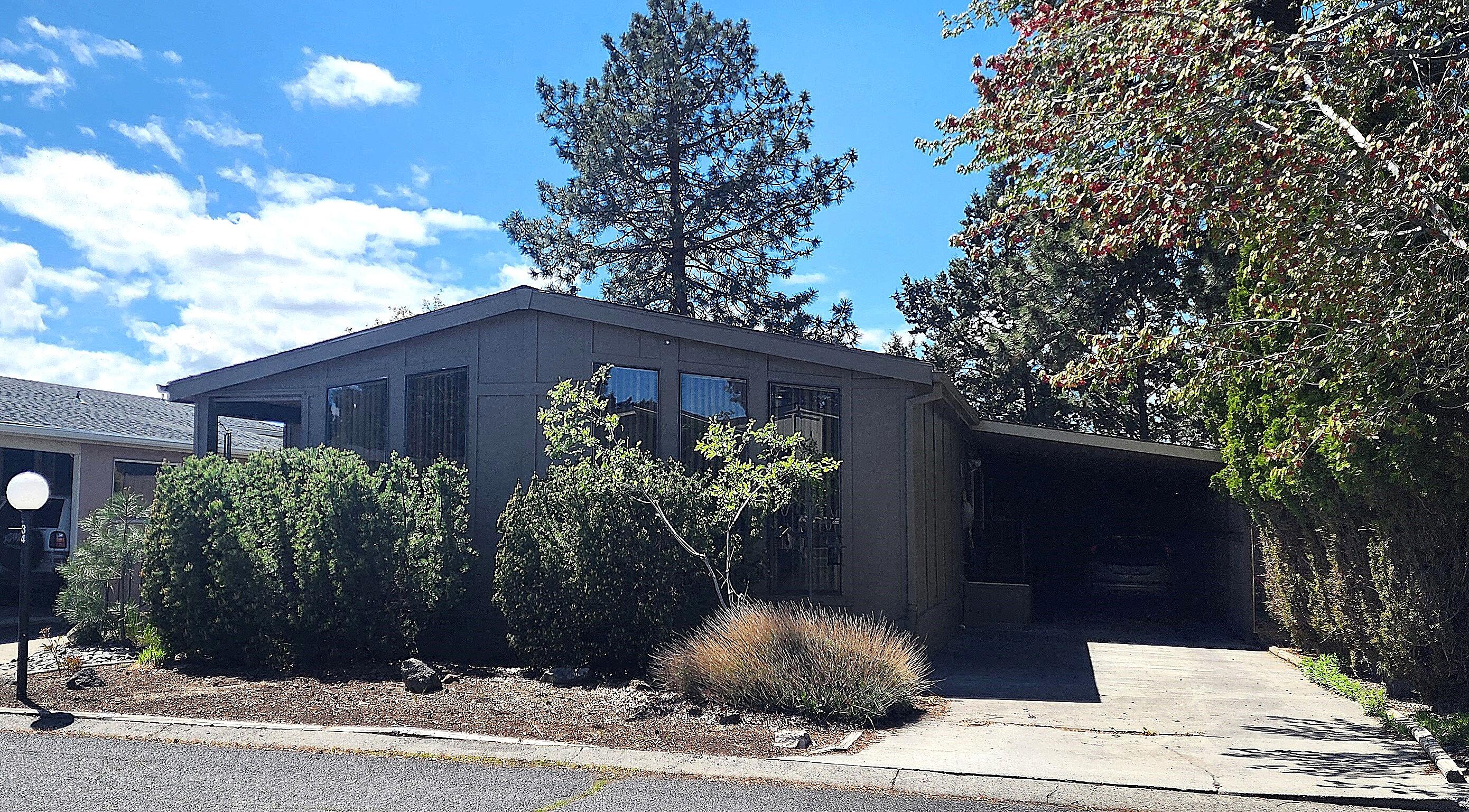 1001 Southeast 15th Street, Unit 34 Bend, OR 97702 - Photo 2 of 43 Home has long driveway and deep carport
