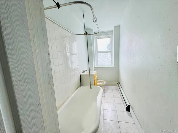 a bathroom with a bathtub and shower