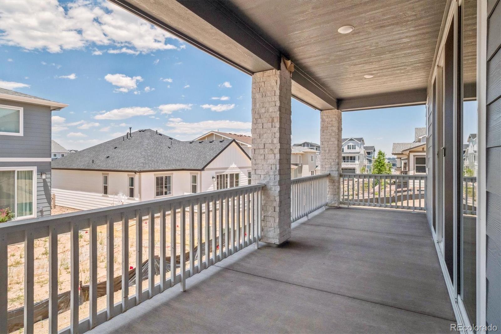 8317 Eagle River Street Littleton, CO 80125 - Photo 17 of 18 a view of a houses from balcony