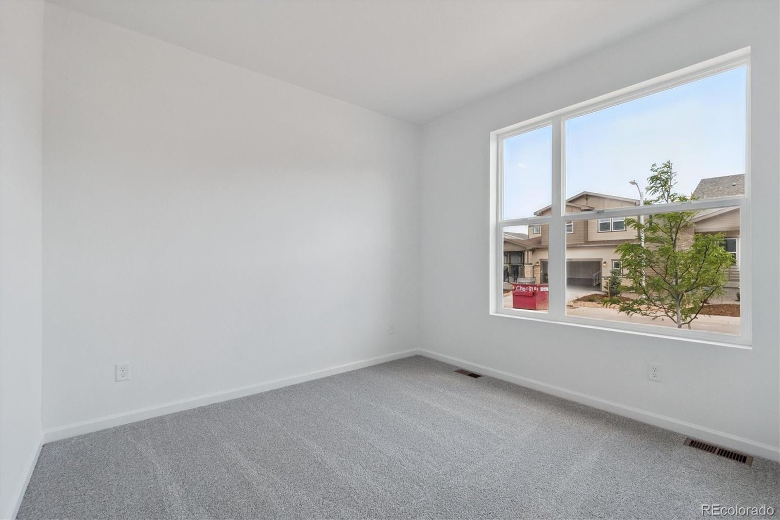 8317 Eagle River Street Littleton, CO 80125 - Photo 2 of 18 an empty room with a window