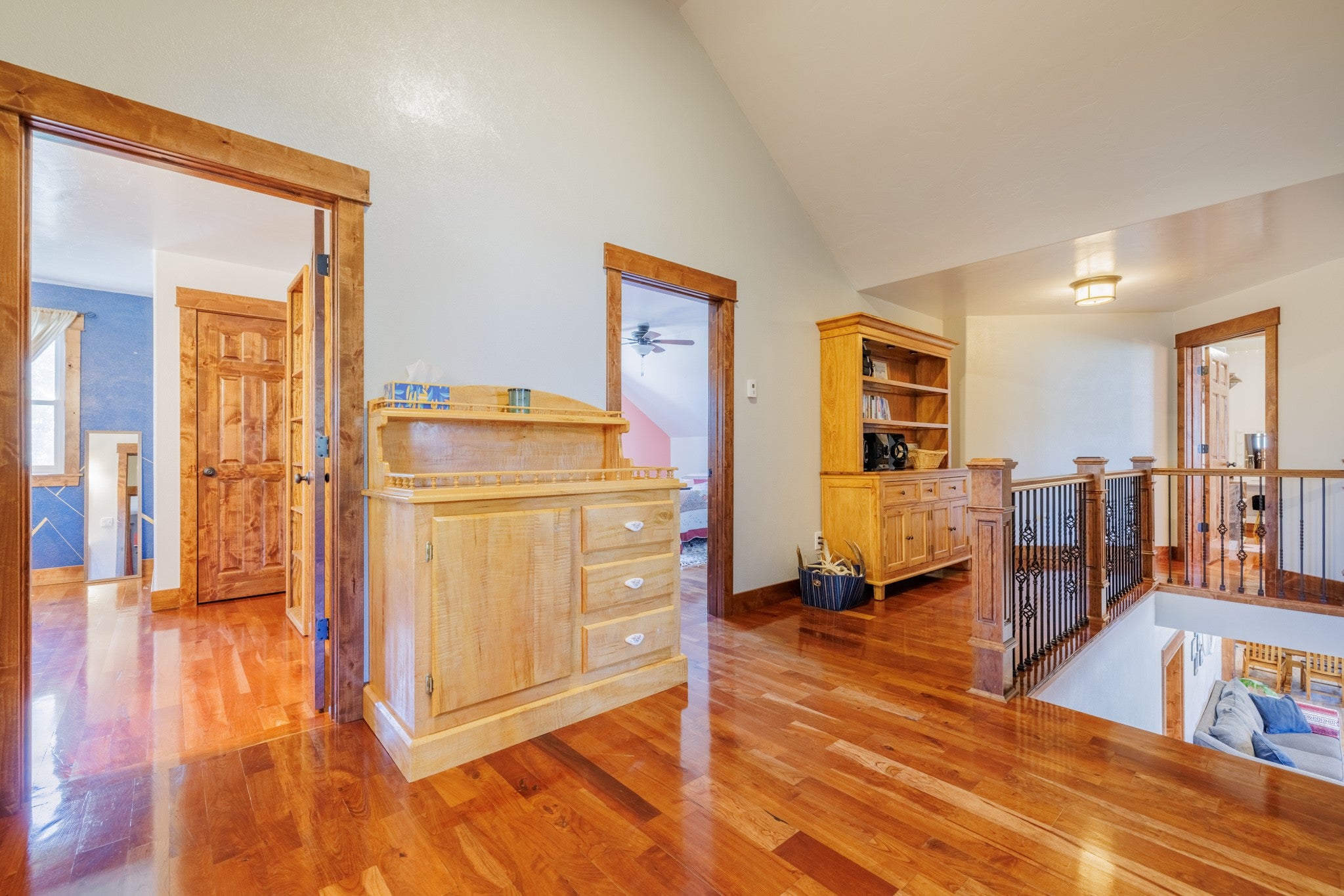 58 Gilman Road Garrison, MT 59731 - Photo 63 of 91 Hallway with an upstairs landing, light wood finished floors, and high vaulted ceiling
