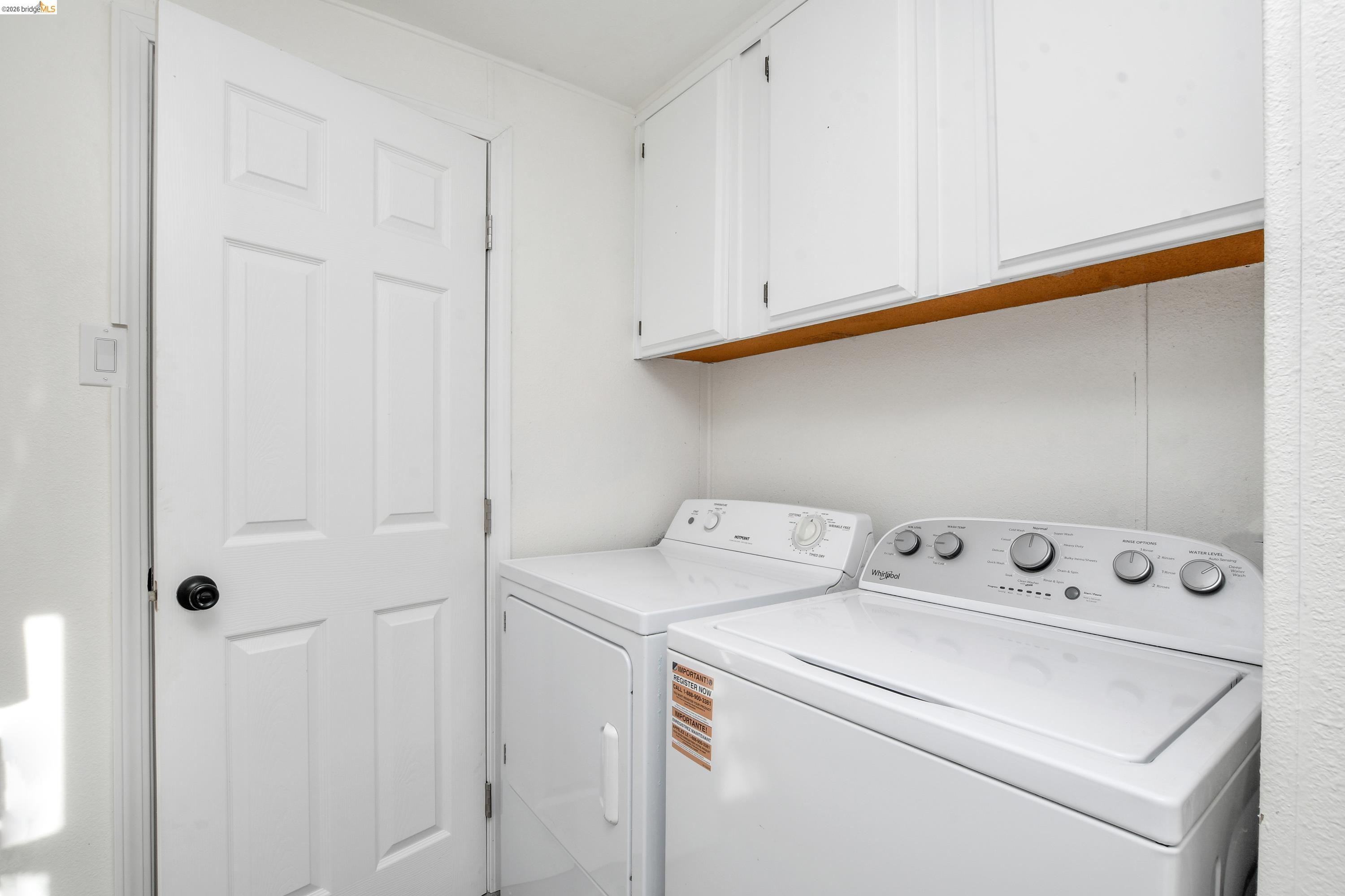 14 Del Rio Pittsburg, CA 94565 - Photo 11 of 25 Laundry Located in Bathroom #1 with washer and dryer and cabinet space