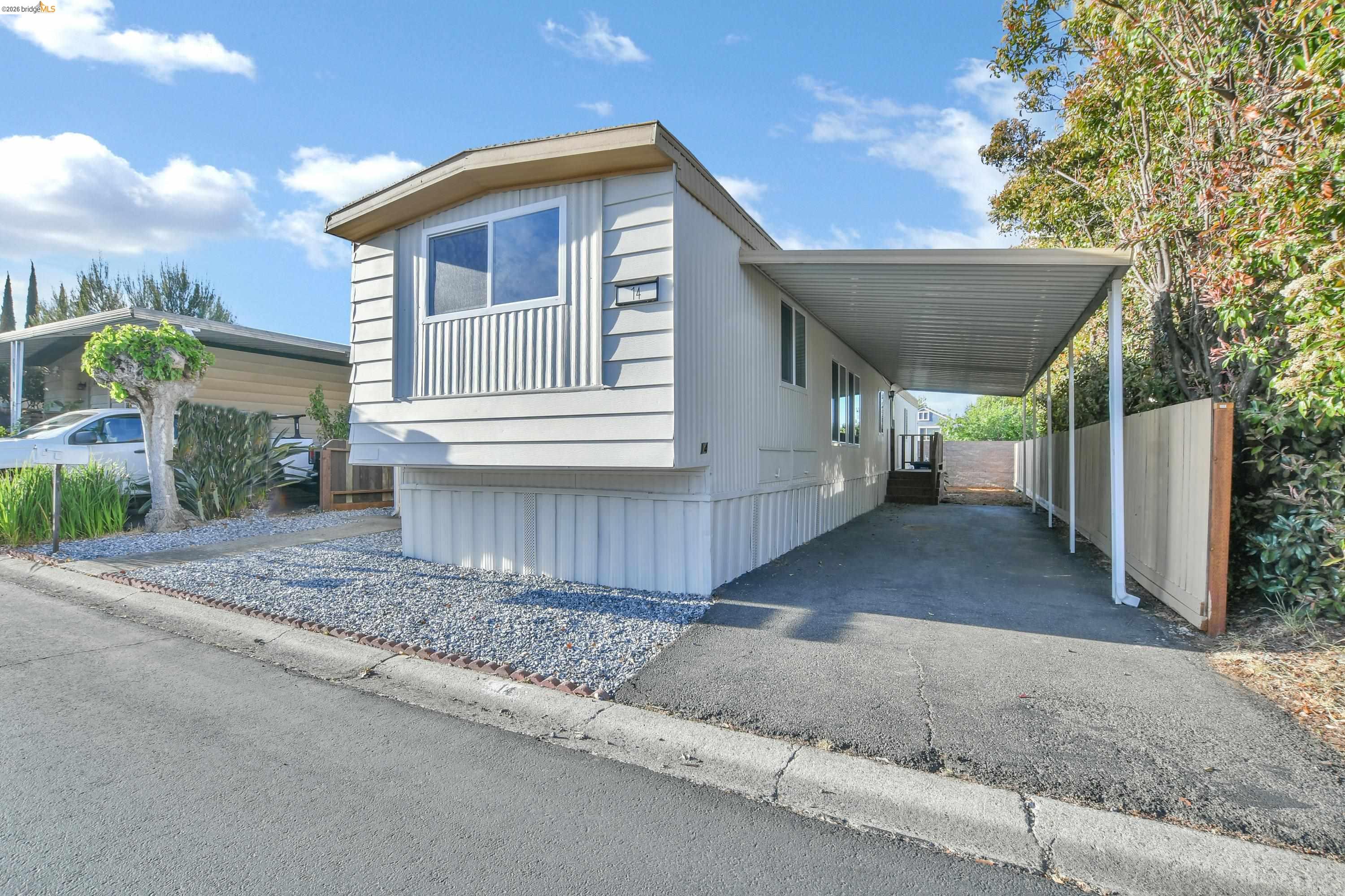 14 Del Rio Pittsburg, CA 94565 - Photo 19 of 25 View of front of home featuring a carport and driveway