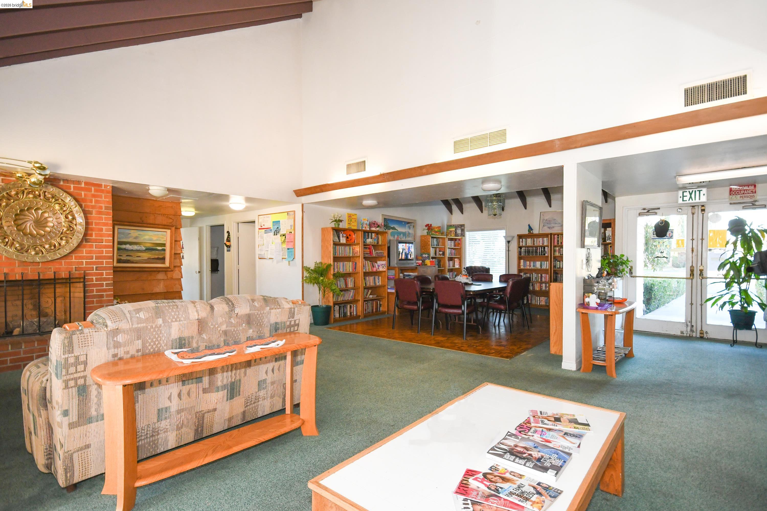 14 Del Rio Pittsburg, CA 94565 - Photo 21 of 25 Community clubhouse offering seating areas, fireplace, and a mini library for residents to enjoy